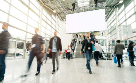 blurred people in a modern hallの写真素材