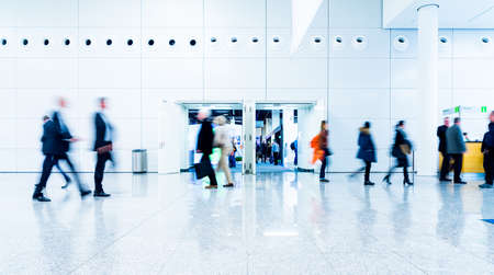 blurred people at a trade fair hallの写真素材