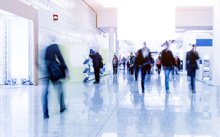 blurred people at a trade fair hallの写真素材