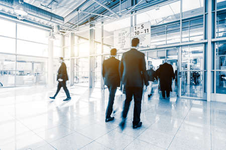 blurred people at a trade fair hallのeditorial素材