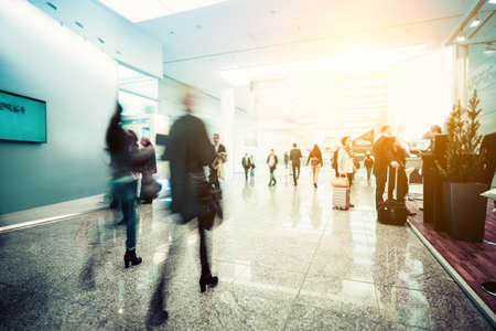 blurred people at a trade fair hallの写真素材
