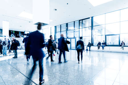 blurred people at a trade fair hallの写真素材