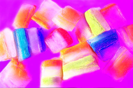 Slices of ice with alternating, colors with pink background