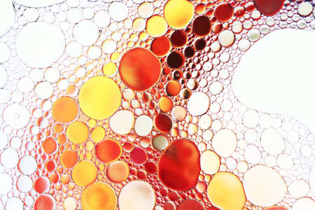 Close up of oil drop on water surface. Abstract background.の写真素材