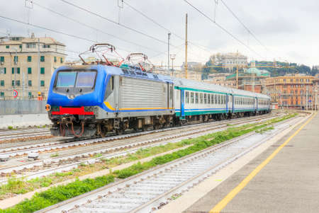 Italian train station. View of train station with train stop. Genova Brignole. HDR Version