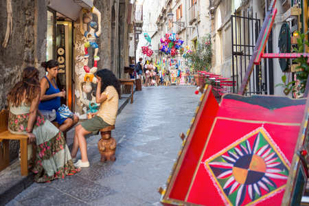 August 24, 2017 - Ortigia (Siracusa) - Italy: view of a characteristic alley of Ortigia (Sicily), Sicilian cart in the foreground.のeditorial素材