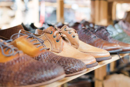 Men's shoes on shelf. Selective focus and close upの写真素材