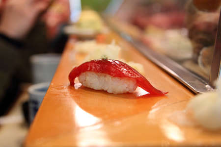 tuna sushi on sushi barの写真素材