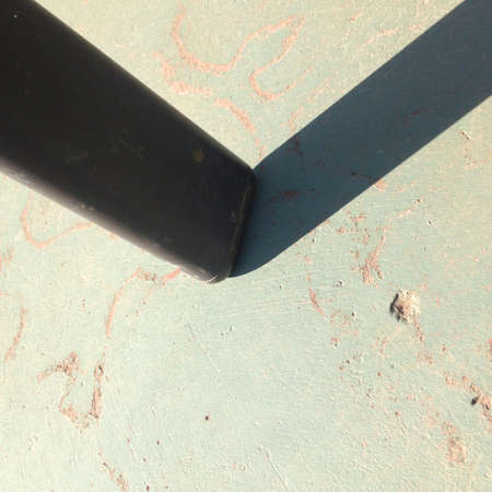 Shadow of chair leg on concrete floorの素材
