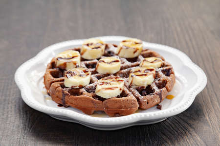 Chocolate banana waffle with caramel sauceの写真素材