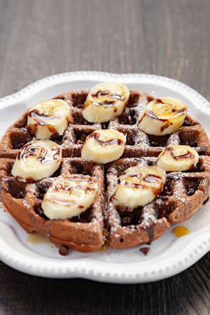 Chocolate banana waffle with caramel sauceの写真素材