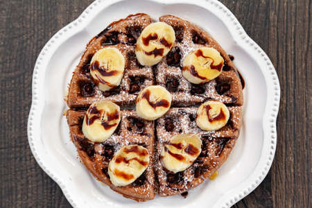 Chocolate banana waffle with caramel sauceの写真素材