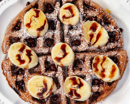 Chocolate banana waffle with caramel sauceの写真素材