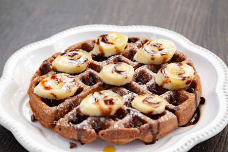 Chocolate banana waffle with caramel sauceの写真素材