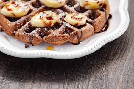 Chocolate banana waffle with caramel sauceの写真素材