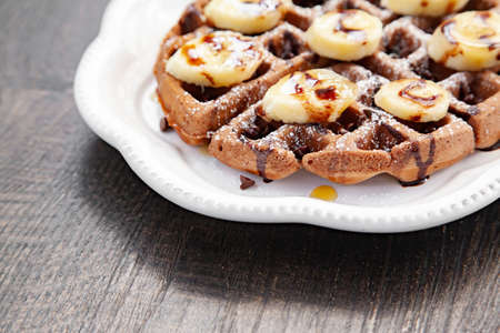 Chocolate banana waffle with caramel sauceの写真素材