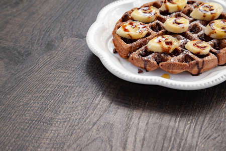 Chocolate banana waffle with caramel sauceの写真素材