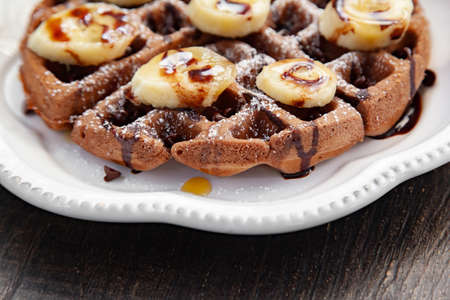 Chocolate banana waffle with caramel sauceの写真素材