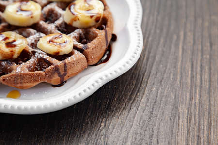 Chocolate banana waffle with caramel sauceの写真素材