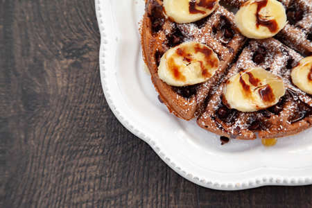 Chocolate banana waffle with caramel sauceの写真素材