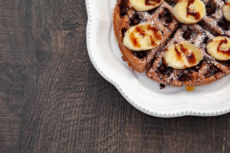 Chocolate banana waffle with caramel sauceの写真素材
