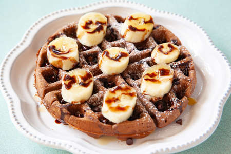 Chocolate banana waffle with caramel sauceの写真素材