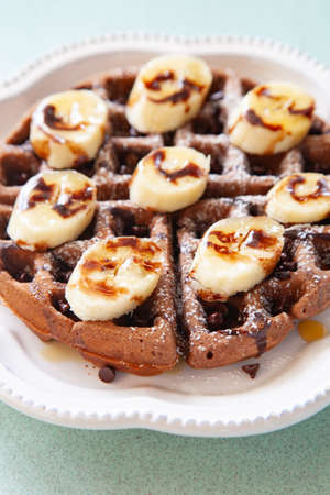 Chocolate banana waffle with caramel sauceの写真素材