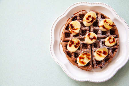 Chocolate banana waffle with caramel sauceの写真素材