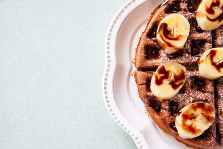 Chocolate banana waffle with caramel sauceの写真素材