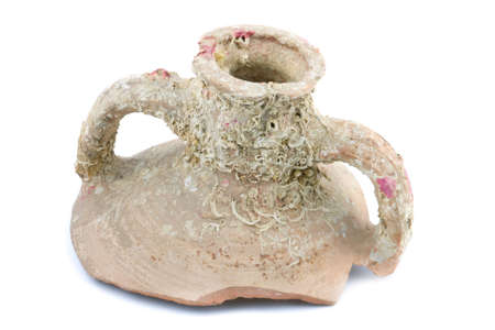 Piece of broken ancient mug with fossils isolated on white backgroundの写真素材