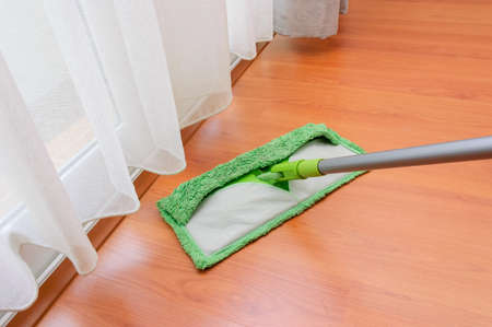 Cleaning mop in action of floor cleaning の写真素材