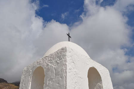 White Hermitage against a cloudy sky in the village of Felix, Spainの写真素材
