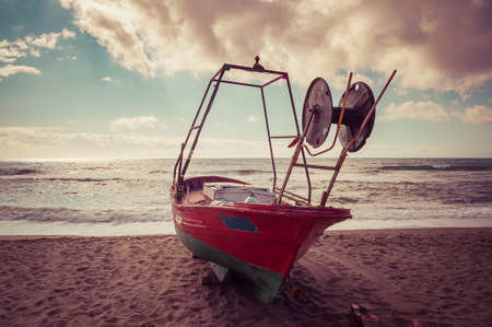 Old fishing boat on the beachの写真素材
