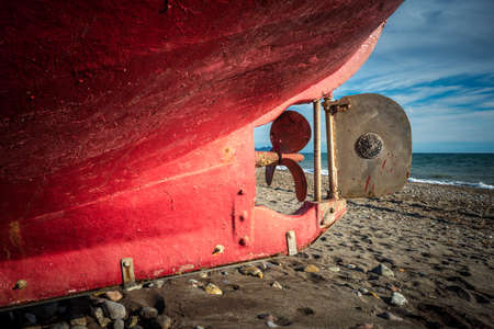 view of the back of a fishing boat with helm and rudderの写真素材
