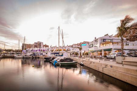 Roquetas de Mar, Spain; September 1st 2021: Aguadulce marina at golden hour. Restaurants like Foster's Hollywood, El Paladar, Domino's Pizza and moreのeditorial素材