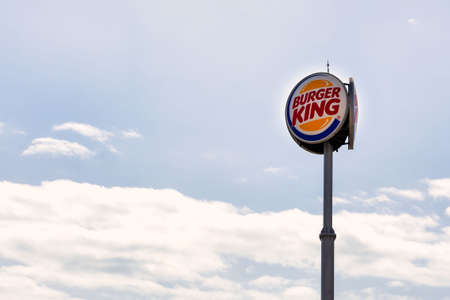 VÃ­car, Spain; September 23th 2021: Large Burger King sign with logo, in a shopping mall against blue skyのeditorial素材