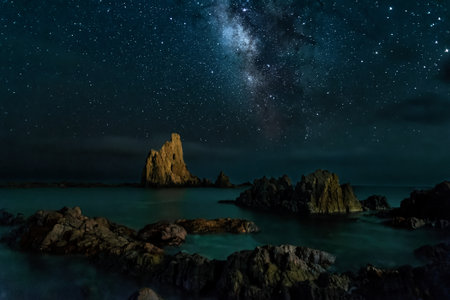 the milky way at starry night over the sea on the reef of cape gata cabo de gata-nijarの写真素材