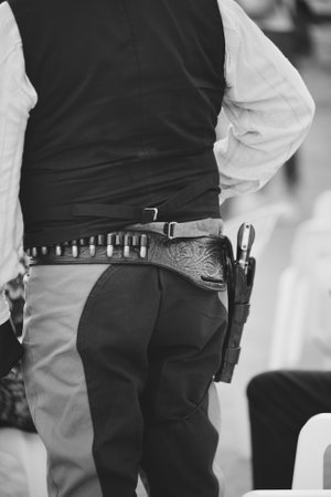 holster canana belt with bullets and pistol worn by a sheriff or a bandit in the American Westの写真素材