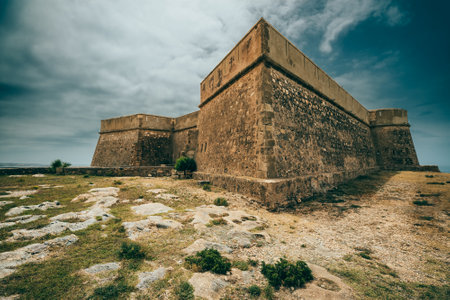 defensive square tower with strong fortress wallの写真素材