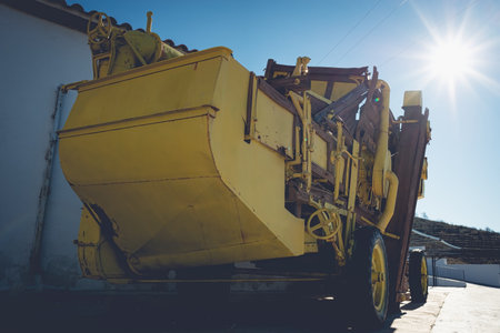 Old yellow threshing machineの写真素材