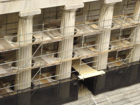 Under Renovation - Scaffold around Columns of Century Old Buildingの写真素材