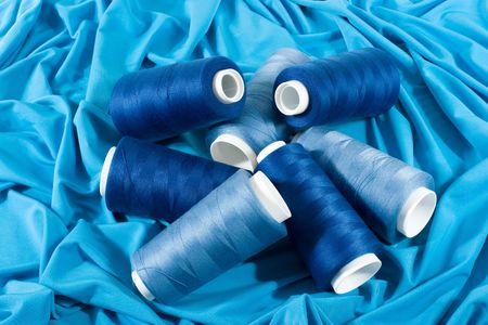 Light blue and dark blue threads on middle blue cloth