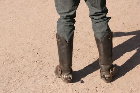 Cowboy wearing leather boots with spurs