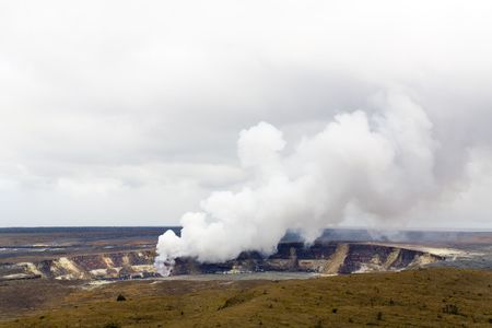 Caldera at Kilauea Summit with Rising Volcano Smoke Cloud, Big Island, Hawaiiの写真素材