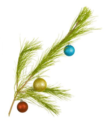 Fir twig with Christmas decorative balls; isolated on whiteの写真素材