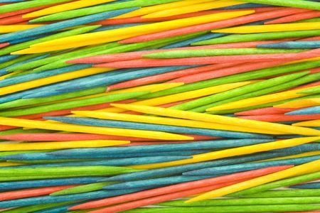 Colored wooden toothpicks background, close up, macro viewの写真素材