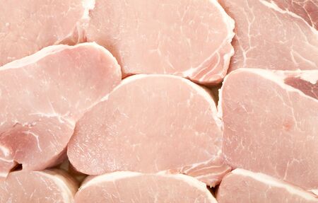 Fresh pork meat pieces background, close up, macro viewの写真素材