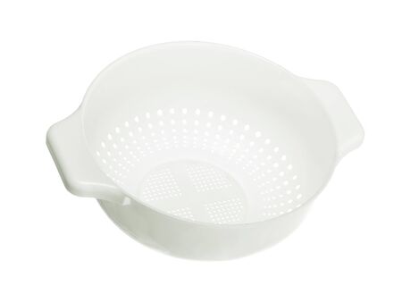 Kitchen plastic colander/sieve; isolated on white backgroundの写真素材