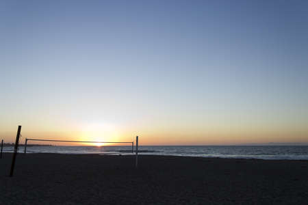 Sun caught in volleyball net, Ventura beach, CAの写真素材
