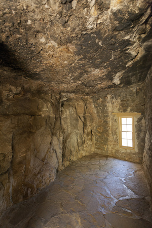 Room with a single window in stone and mortar Clevenger House, Thompson Arboretum State Park, Arizonaのeditorial素材